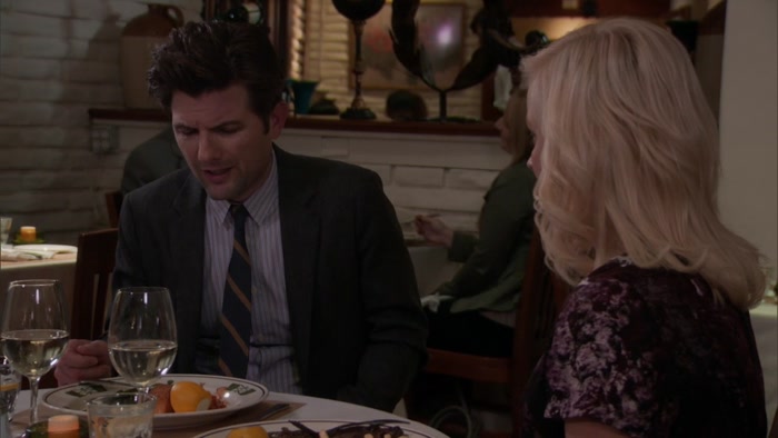OH, MY GOD. LESLIE, HE'S A COP. 
