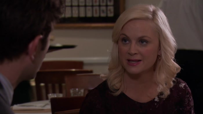 OH, MY GOD. LESLIE, HE'S A COP. 