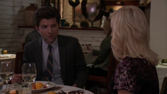 OH, MY GOD. LESLIE, HE'S A COP. 