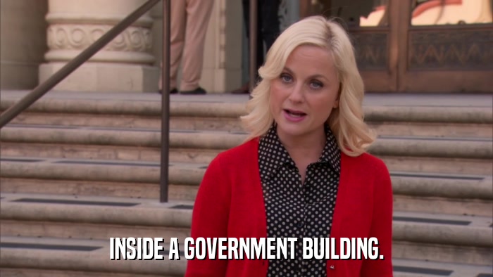 INSIDE A GOVERNMENT BUILDING.  