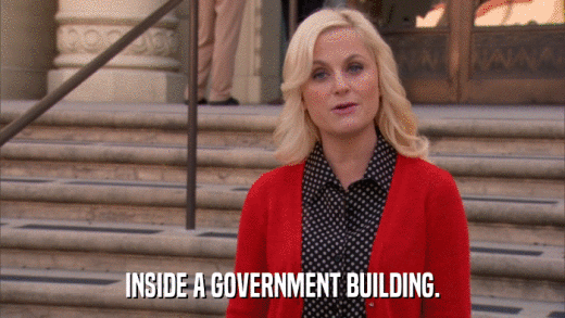 INSIDE A GOVERNMENT BUILDING.  