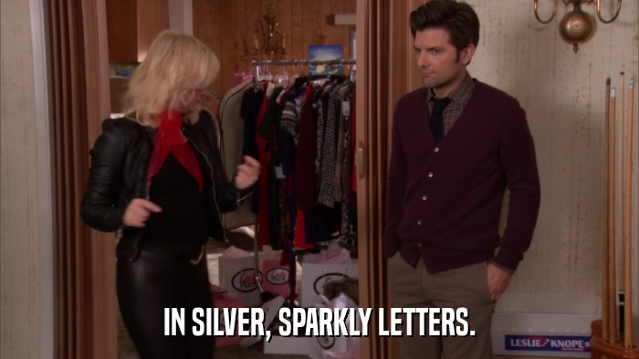 IN SILVER, SPARKLY LETTERS.  