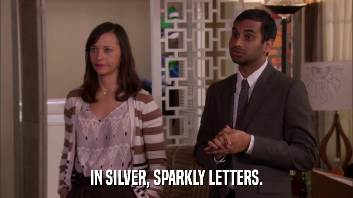 IN SILVER, SPARKLY LETTERS.  