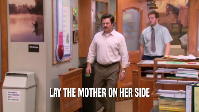 LAY THE MOTHER ON HER SIDE  