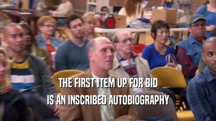 THE FIRST ITEM UP FOR BID IS AN INSCRIBED AUTOBIOGRAPHY 
