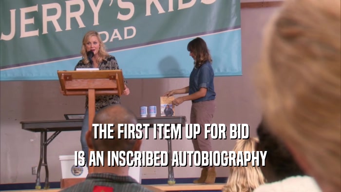 THE FIRST ITEM UP FOR BID IS AN INSCRIBED AUTOBIOGRAPHY 