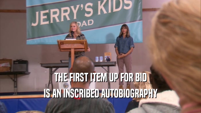 THE FIRST ITEM UP FOR BID IS AN INSCRIBED AUTOBIOGRAPHY 