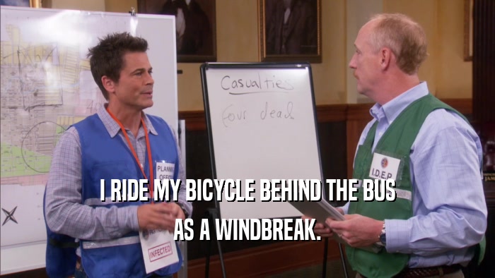 I RIDE MY BICYCLE BEHIND THE BUS AS A WINDBREAK. 