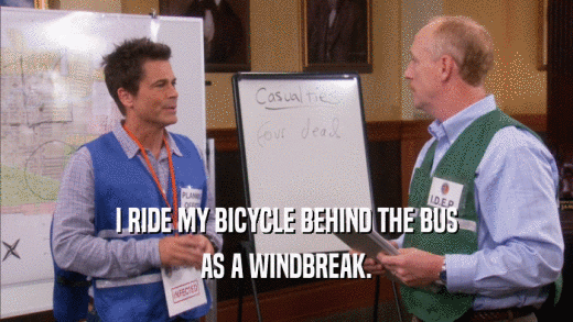 I RIDE MY BICYCLE BEHIND THE BUS AS A WINDBREAK. 