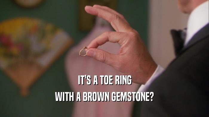 IT'S A TOE RING WITH A BROWN GEMSTONE? 