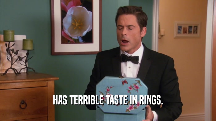 HAS TERRIBLE TASTE IN RINGS.  