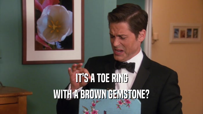 IT'S A TOE RING WITH A BROWN GEMSTONE? 