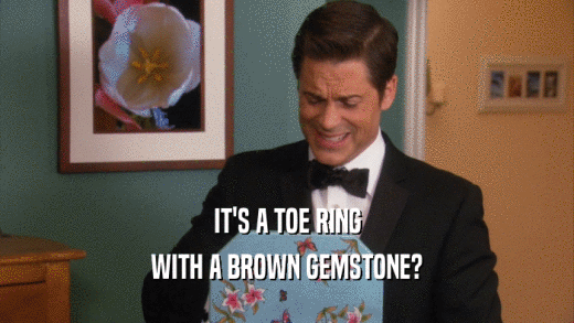 IT'S A TOE RING WITH A BROWN GEMSTONE? 