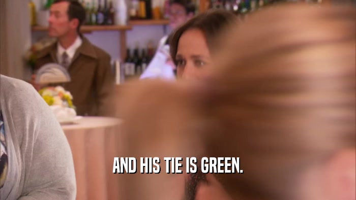 AND HIS TIE IS GREEN.  