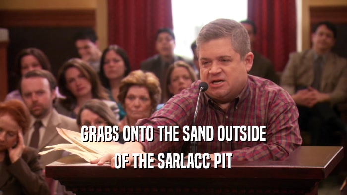 GRABS ONTO THE SAND OUTSIDE OF THE SARLACC PIT 