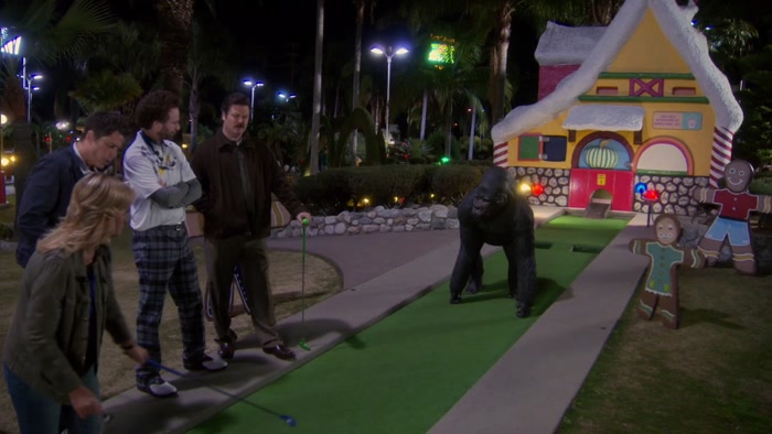 WHY IS THERE A GORILLA GUARDING THIS GINGERBREAD HOUSE? 