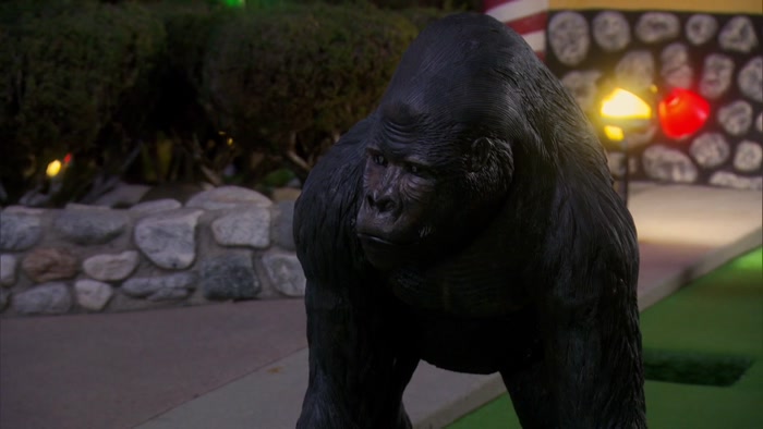 WHY IS THERE A GORILLA GUARDING THIS GINGERBREAD HOUSE? 