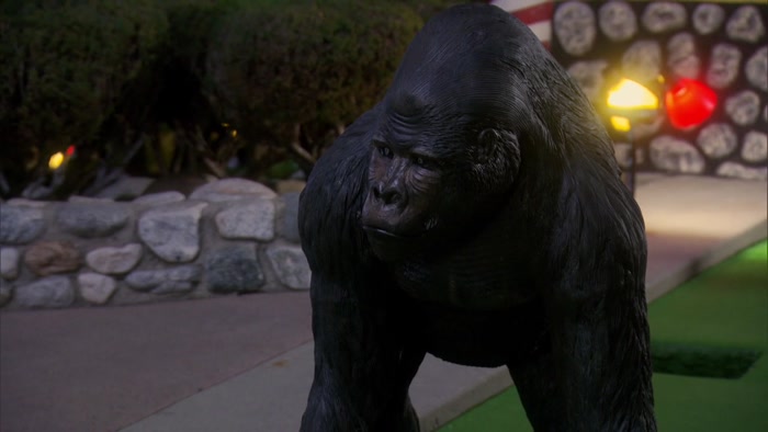 WHY IS THERE A GORILLA GUARDING THIS GINGERBREAD HOUSE? 