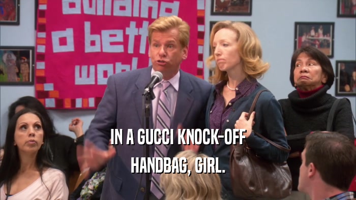 IN A GUCCI KNOCK-OFF HANDBAG, GIRL. 