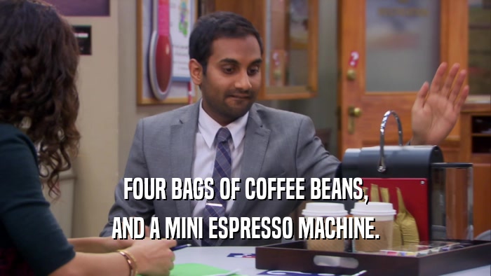 FOUR BAGS OF COFFEE BEANS, AND A MINI ESPRESSO MACHINE. 