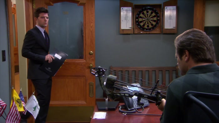WHOA. I AM PRETTY SURE YOU SHOULDN'T HAVE A WEAPON AT WORK. 