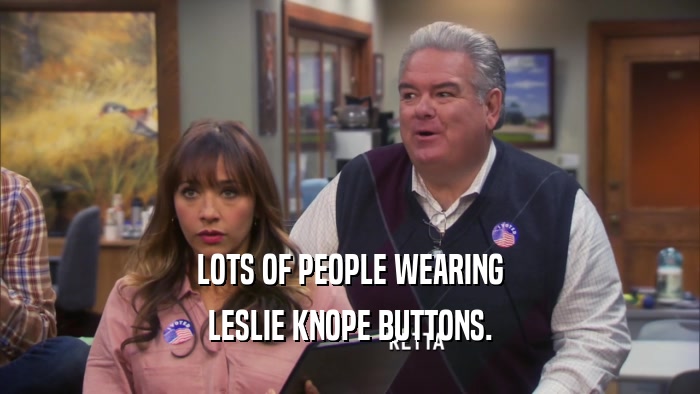 LOTS OF PEOPLE WEARING LESLIE KNOPE BUTTONS. 