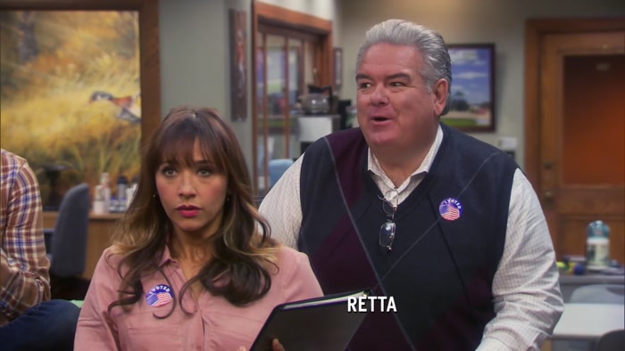LOTS OF PEOPLE WEARING LESLIE KNOPE BUTTONS. 