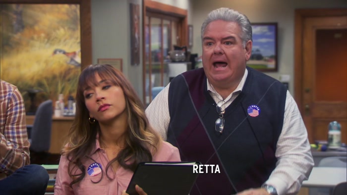 LOTS OF PEOPLE WEARING LESLIE KNOPE BUTTONS. 