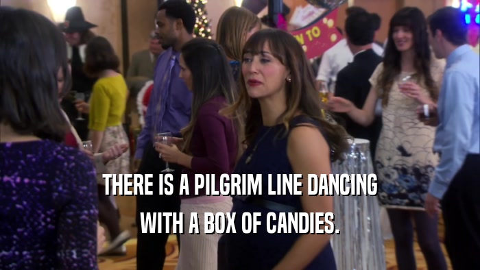 THERE IS A PILGRIM LINE DANCING WITH A BOX OF CANDIES. 