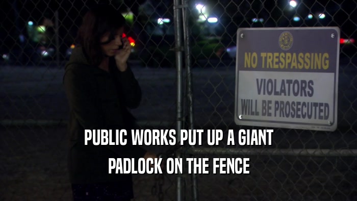 PUBLIC WORKS PUT UP A GIANT PADLOCK ON THE FENCE 