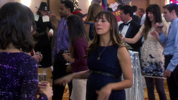 THERE IS A PILGRIM LINE DANCING WITH A BOX OF CANDIES. 