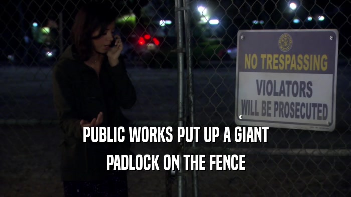 PUBLIC WORKS PUT UP A GIANT PADLOCK ON THE FENCE 