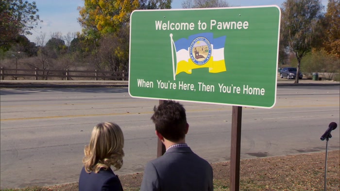 THE WRONG WAY AND IT'S WELCOMING YOU TO PAWNEE AS YOU'RE LEAVING. 