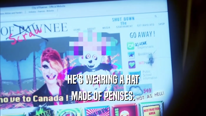 HE'S WEARING A HAT MADE OF PENISES. 
