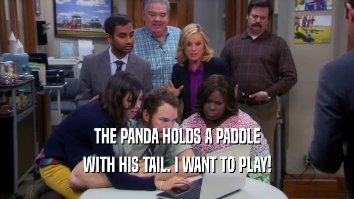 THE PANDA HOLDS A PADDLE WITH HIS TAIL. I WANT TO PLAY! 