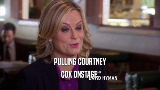 PULLING COURTNEY COX ONSTAGE. 