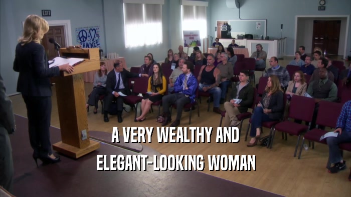 A VERY WEALTHY AND ELEGANT-LOOKING WOMAN 