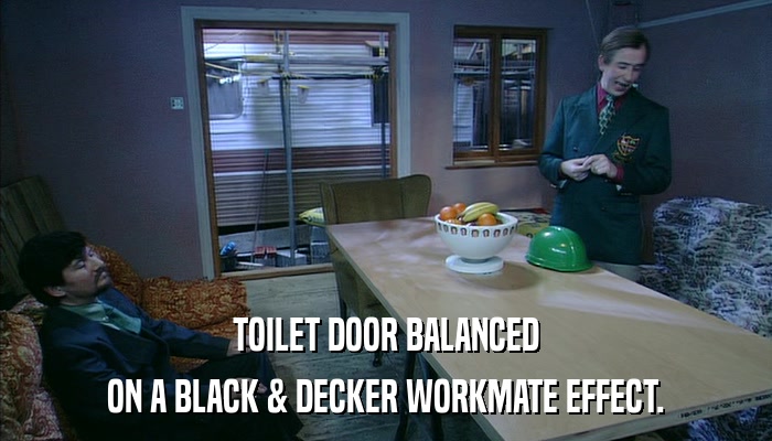 TOILET DOOR BALANCED ON A BLACK & DECKER WORKMATE EFFECT. 
