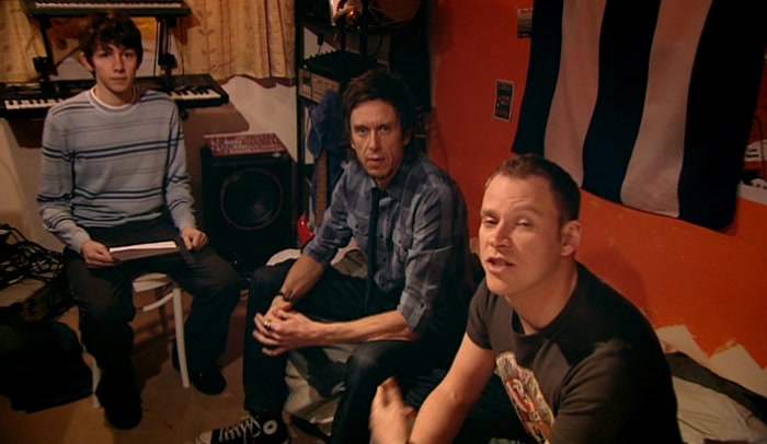 BARNEY'S STAYING OVER FOR A BIT. HE'S JOINED THE BAND. 