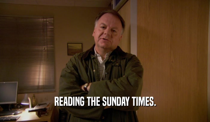 READING THE SUNDAY TIMES.  