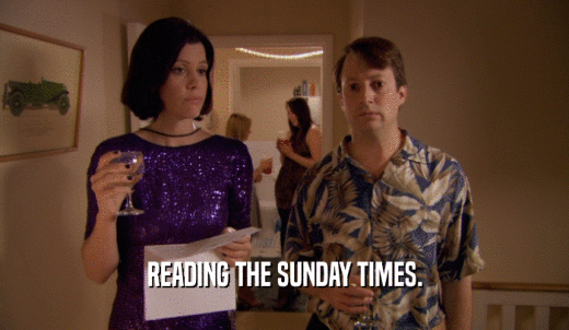 READING THE SUNDAY TIMES.  