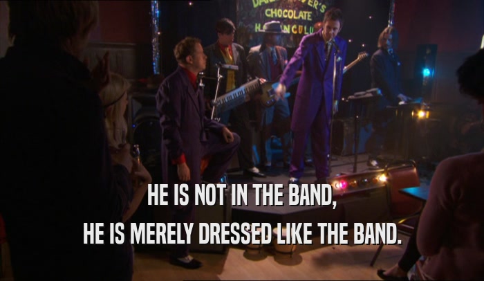 HE IS NOT IN THE BAND, HE IS MERELY DRESSED LIKE THE BAND. 