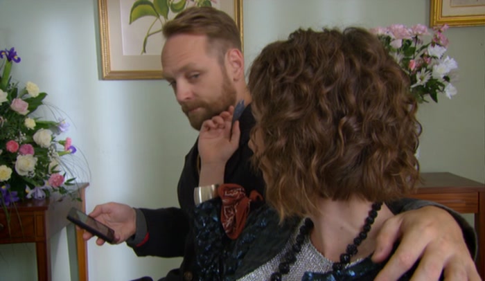 LOOKING AT HIS PHONE AND SHE LOVES IT. I COULD LOOK AT MY PHONE. 
