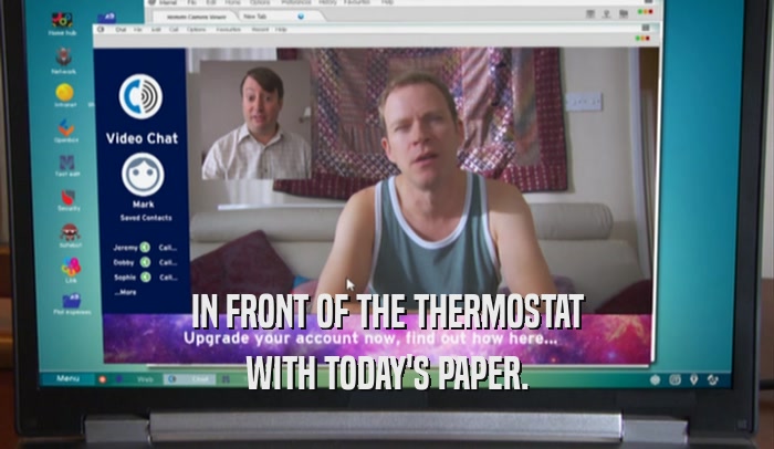 IN FRONT OF THE THERMOSTAT WITH TODAY'S PAPER. 