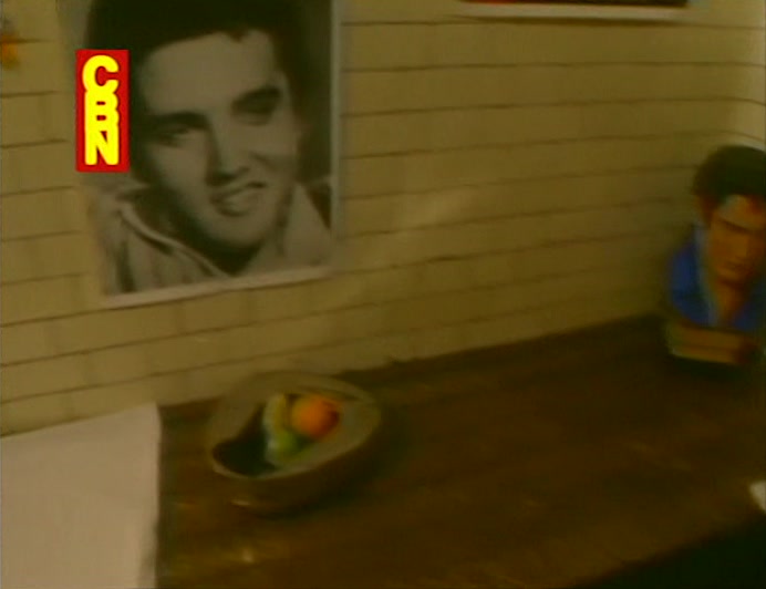 AMONG THOSE WATCHING BAXTER GET ALL SHOOK UP IS PRESLEY FAN CLUB PRESIDENT ALVIN HOLLER. 