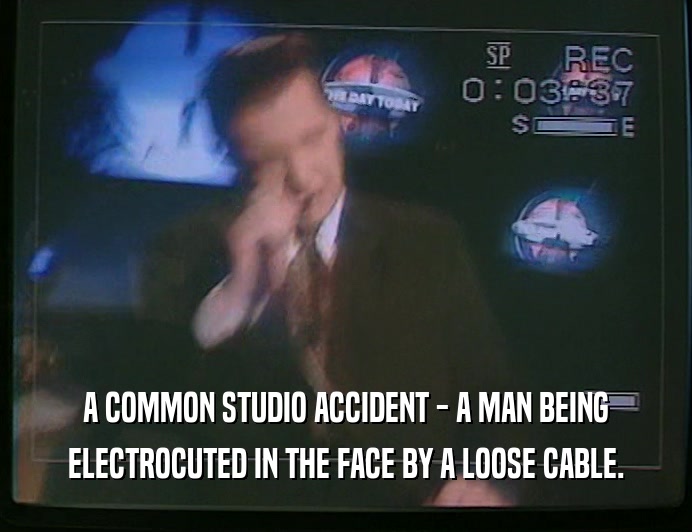 A COMMON STUDIO ACCIDENT - A MAN BEING
 ELECTROCUTED IN THE FACE BY A LOOSE CABLE.
 