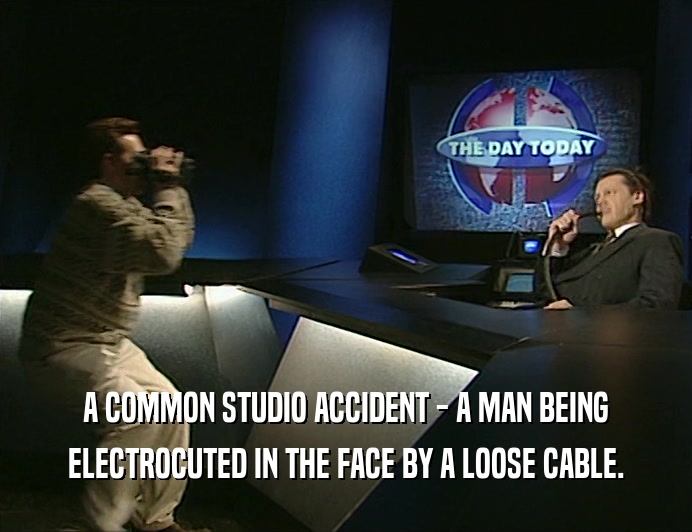 A COMMON STUDIO ACCIDENT - A MAN BEING
 ELECTROCUTED IN THE FACE BY A LOOSE CABLE.
 