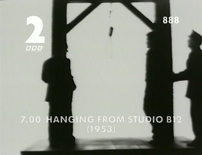 WE'RE AT THE HANGING. IT'S A VERY SOMBRE ATMOSPHERE. 