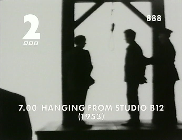 WE'RE AT THE HANGING. IT'S A VERY SOMBRE ATMOSPHERE. 