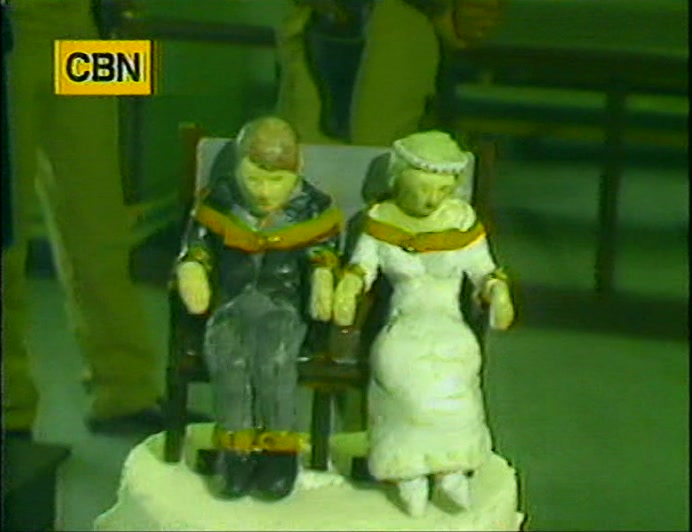 THERE'S EVEN A CAKE FOR THIS WEDDING WAKE,
 BUT FOR MINISTER ALVIN HOLLER,
 